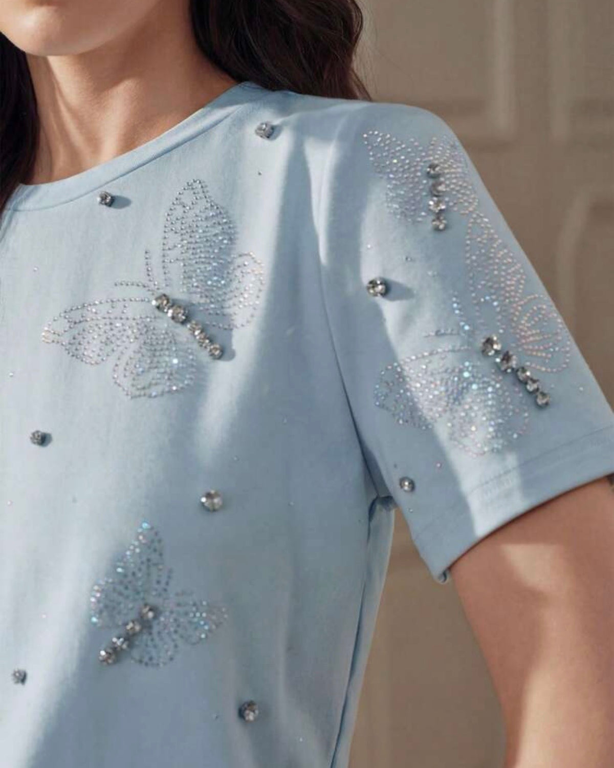Blusa celeste con perlas