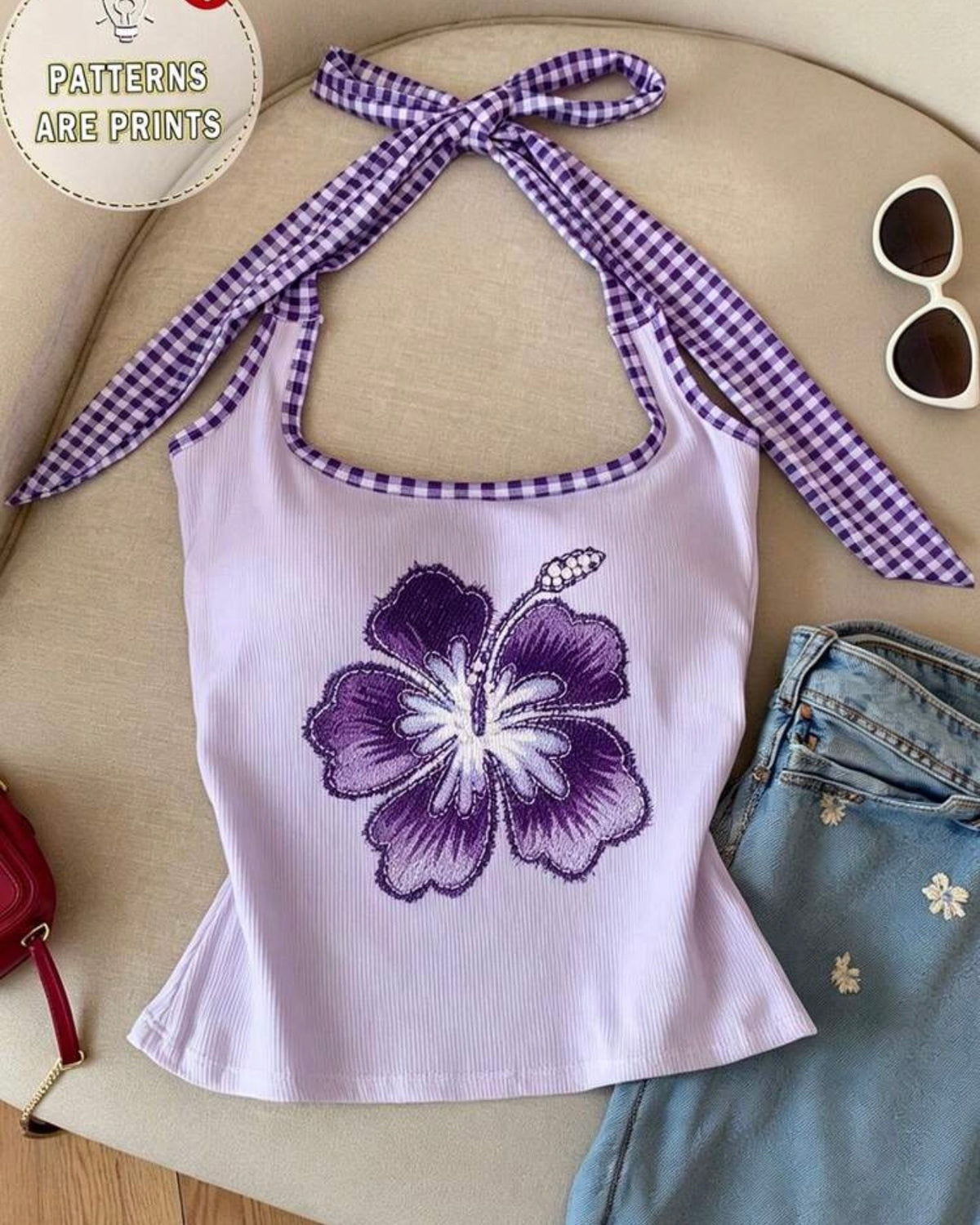 Blusa lila con flor estampada