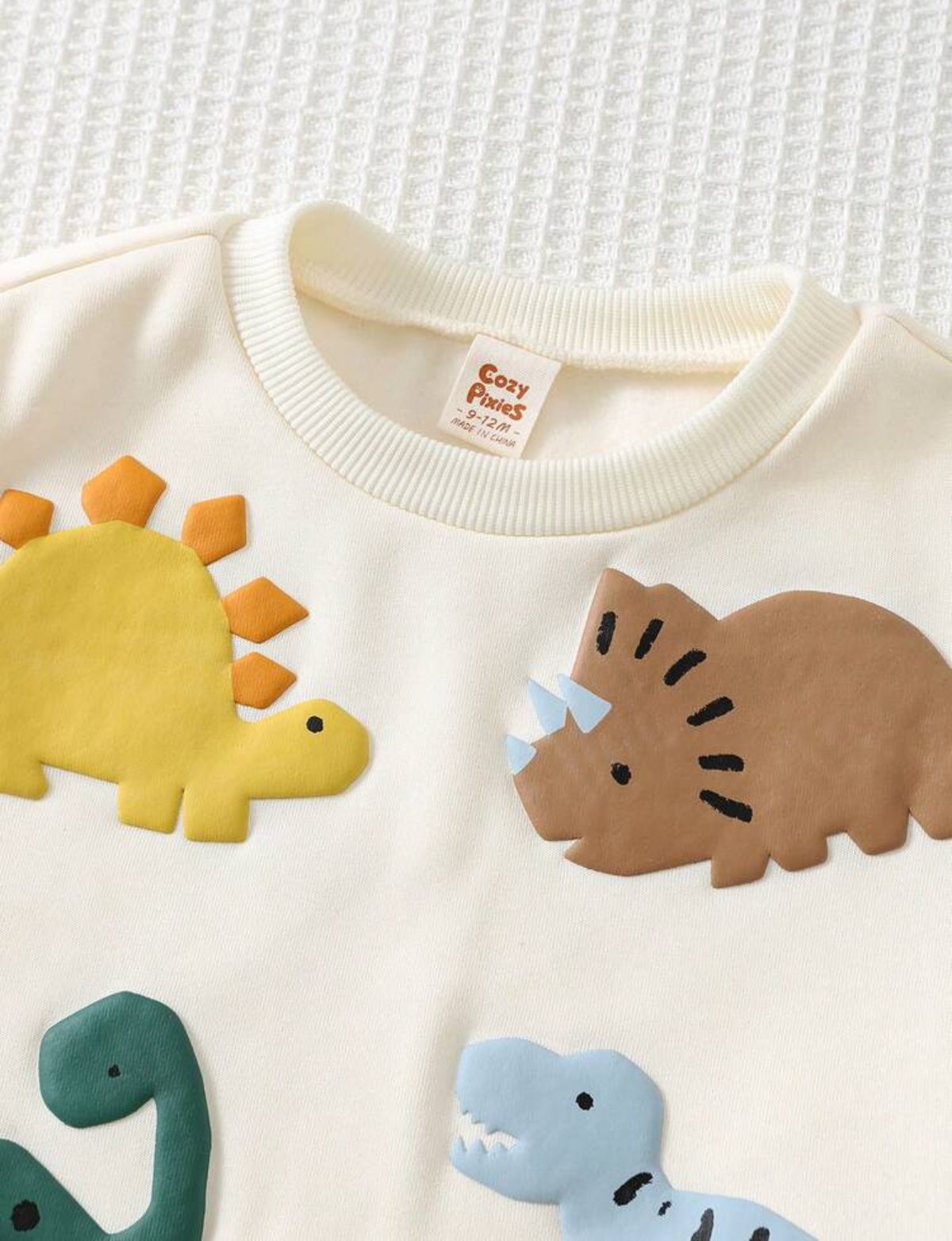 Suéter con dinosaurios